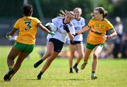 5 August 2023; Orlaith Power of Waterford in action against Abigail Temple Asokuh, left, and Katie Dowds of Donegal during the ZuCar All-Ireland Ladies Football U18 C final match between Donegal and Waterford at Kinnegad in Westmeath. Photo by Piaras Ó Mídheach/Sportsfile