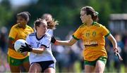 5 August 2023; Orlaith Power of Waterford in action against Katie Dowds of Donegal during the ZuCar All-Ireland Ladies Football U18 C final match between Donegal and Waterford at Kinnegad in Westmeath. Photo by Piaras Ó Mídheach/Sportsfile