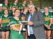 5 August 2023; Kerry captain Roisín Rahilly is presented with the cup from Robbie Smyth, Munster LGFA President and LGFA Vice-President, following the ZuCar All-Ireland Ladies Football U18 B final match between Kerry and Sligo at MacDonagh Park in Nenagh, Tipperary. Photo by Seb Daly/Sportsfile