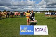 5 August 2023; Ava Walsh of Donegal receives the Player of the Match award from Trina Murray, Leinster LGFA President and LGFA Vice-President, following the ZuCar All-Ireland Ladies Football U18 C final match between Donegal and Waterford at Kinnegad in Westmeath. Photo by Piaras Ó Mídheach/Sportsfile
