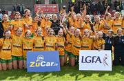 5 August 2023; Donegal captain Niamh Harkin holds the cup aloft during celebrations after their side's victory in the ZuCar All-Ireland Ladies Football U18 C final match between Donegal and Waterford at Kinnegad in Westmeath. Photo by Piaras Ó Mídheach/Sportsfile