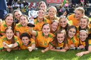 5 August 2023; Meabh McAteer of Donegal, 24, holds the cup aloft during celebrations after her side's victory in the ZuCar All-Ireland Ladies Football U18 C final match between Donegal and Waterford at Kinnegad in Westmeath. Photo by Piaras Ó Mídheach/Sportsfile