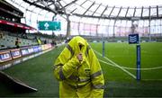 5 August 2023; A steward shelters from the rain before the Bank of Ireland Nations Series match between Ireland and Italy at the Aviva Stadium in Dublin. Photo by Harry Murphy/Sportsfile