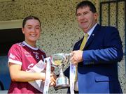 5 August 2023; Galway captain Aoibhinn Eilian is presented with the cup by Uachtarán Cumann Peil Gael na mBan, Mícheál Naughton after the ZuCar All-Ireland Ladies Football U18 A final match between Galway and Kildare at Glennon Brothers Pearse Park in Longford. Photo by Sportsfile