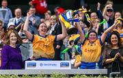6 August 2023; Clare players Sinéad O'Keeffe, left, and Sinéad Hogg lift the Kay Mills Cup after her side's victory in the Glen Dimplex All-Ireland Camogie Championship Premier Junior Final match between Clare and Tipperary at Croke Park in Dublin. Photo by Piaras Ó Mídheach/Sportsfile