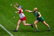 6 August 2023; Mary Hegarty of Derry in action against Claire Coffey of Meath during the Glen Dimplex All-Ireland Camogie Championship Premier Intermediate Final match between Meath and Derry at Croke Park in Dublin. Photo by Piaras Ó Mídheach/Sportsfile