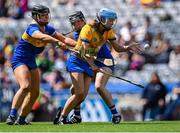 6 August 2023; Caoimhe Cahill of Clare in action against Aisling Sheedy, left, and Ciara Ryan of Tipperary during the Glen Dimplex All-Ireland Camogie Championship Premier Junior Final match between Clare and Tipperary at Croke Park in Dublin. Photo by Piaras Ó Mídheach/Sportsfile