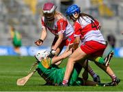 6 August 2023; Abbye Donnelly of Meath is fouled by Sinead McGill, 4, and Lauren McKenna of Derry during the Glen Dimplex All-Ireland Camogie Championship Premier Intermediate Final match between Meath and Derry at Croke Park in Dublin. Photo by Stephen Marken/Sportsfile