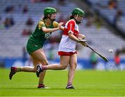 6 August 2023; Mairéad McNicholl of Derry in action against Leah Devine of Meath during the Glen Dimplex All-Ireland Camogie Championship Premier Intermediate Final match between Meath and Derry at Croke Park in Dublin. Photo by Piaras Ó Mídheach/Sportsfile
