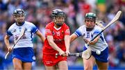 6 August 2022; Amy O'Connor of Cork shoots to score her side's fourth goal, and her hat-trick, under pressure from Laoise Forrest of Waterford, right, during the Glen Dimplex All-Ireland Camogie Championship Premier Senior Final match between Waterford and Cork at Croke Park in Dublin. Photo by Piaras Ó Mídheach/Sportsfile