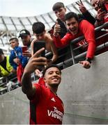 6 August 2023; Jadon Sancho of Manchester United takes a photo with supporters after the pre-season friendly match between Manchester United and Athletic Bilbao at the Aviva Stadium in Dublin. Photo by David Fitzgerald/Sportsfile