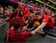 6 August 2023; Jadon Sancho, right, and Jonny Evans of Manchester United with supporters after the pre-season friendly match between Manchester United and Athletic Bilbao at the Aviva Stadium in Dublin. Photo by David Fitzgerald/Sportsfile