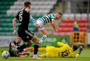6 August 2023; Liam Burt of Shamrock Rovers is tackled by Joshua Honohan of Cork City, left, and goalkeeper Ollie Byrne during the SSE Airtricity Men's Premier Division match between Shamrock Rovers and Cork City at Tallaght Stadium in Dublin. Photo by Seb Daly/Sportsfile