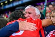 6 August 2022; Saoirse McCarthy of Cork celebrates with her grand-uncle Paschal Robinson after her side’s victory Glen Dimplex All-Ireland Camogie Championship Premier Senior Final match between Waterford and Cork at Croke Park in Dublin. Photo by Piaras Ó Mídheach/Sportsfile