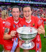 6 August 2022; Cork players, Ashling Thompson, left, and Hannah Looney celebrate with O'Duffy Cup after their side's victory in the Glen Dimplex All-Ireland Camogie Championship Premier Senior Final match between Waterford and Cork at Croke Park in Dublin. Photo by Piaras Ó Mídheach/Sportsfile