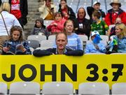 6 August 2022; A spectator holds a John 3:7 sign during the Glen Dimplex All-Ireland Camogie Championship Premier Senior Final match between Waterford and Cork at Croke Park in Dublin. Photo by Stephen Marken/Sportsfile
