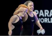 6 August 2023; Nicole Turner of Ireland and Dearbhaile Brady of Ireland embrace after the Women's 50m Butterfly S6 final during day seven of the World Para Swimming Championships 2023 at Manchester Aquatics Centre in Manchester. Photo by Phil Bryan/Sportsfile