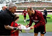6 August 2023; Manchester United mascot Finn O'Shea, age 9, from Clonmel, Tipperary with Christian Eriksen of Manchester United before the pre-season friendly match between Manchester United and Athletic Bilbao at the Aviva Stadium in Dublin. Photo by David Fitzgerald/Sportsfile