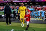 6 August 2023; Manchester United mascot Finn O'Shea, age 9, from Clonmel, Tipperary walks out with Tom Heaton of Manchester United before the pre-season friendly match between Manchester United and Athletic Bilbao at the Aviva Stadium in Dublin. Photo by David Fitzgerald/Sportsfile