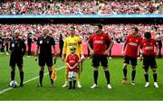 6 August 2023; Manchester United mascot Finn O'Shea, age 9, from Clonmel, Tipperary lines up with Tom Heaton of Manchester United before the pre-season friendly match between Manchester United and Athletic Bilbao at the Aviva Stadium in Dublin. Photo by David Fitzgerald/Sportsfile