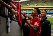 6 August 2023; Jadon Sancho of Manchester United with  supporters after the pre-season friendly match between Manchester United and Athletic Bilbao at the Aviva Stadium in Dublin. Photo by David Fitzgerald/Sportsfile