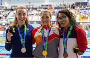 6 August 2023; Ellen Keane of Ireland, left, with her silver medal, Katarina Roxon of Canada with her gold medal, and Anastasiya Dmytriv Dmytriv of Spain with her bronze medal, after competing in Women's 100m Breaststroke SB8 final during day seven of the World Para Swimming Championships 2023 at Manchester Aquatics Centre in Manchester. Photo by Paul Greenwood/Sportsfile