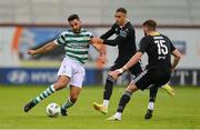 6 August 2023; Roberto Lopes of Shamrock Rovers in action against Jaze Kabia, centre, and Conor Drinan of Cork City during the SSE Airtricity Men's Premier Division match between Shamrock Rovers and Cork City at Tallaght Stadium in Dublin. Photo by Seb Daly/Sportsfile