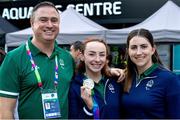 6 August 2023; Team Ireland swimmer Ellen Keane, centre, with swimming performance director Dave Malone and swimming operations manager Hayley Burke after day seven of the World Para Swimming Championships 2023 at Manchester Aquatics Centre in Manchester. Photo by Paul Greenwood/Sportsfile