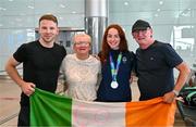 7 August 2023; The 2023 Irish World Para Swimming Championships Silver medalist Ellen Keane poses for a photograph with from left, her brother Philip, mother Laura and father, Eddie at Dublin Airport on Team Ireland's return from the 2023 World Para Swimming Championships in Manchester. Photo by Tyler Miller/Sportsfile