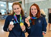 7 August 2023; The 2023 Irish World Para Swimming Championships swimmers Róisín Ní Riain, left, and Ellen Keane pose for a photograph with their medals at Dublin Airport on Team Ireland's return from the 2023 World Para Swimming Championships in Manchester. Photo by Tyler Miller/Sportsfile