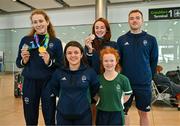 7 August 2023; The 2023 Irish World Para Swimming Championships team of Róisín Ní Riai, top left, Ellen Keane, centre, Barry McClements, top right, Nicole Turner, bottom left, and Dearbhaile Brady are pictured at Dublin Airport on Team Ireland's return from the 2023 World Para Swimming Championships in Manchester. Photo by Tyler Miller/Sportsfile