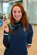 7 August 2023; The 2023 Irish World Para Swimming Championships swimmer Ellen Keane poses for a photograph with her Silver medal at Dublin Airport on Team Ireland's return from the 2023 World Para Swimming Championships in Manchester. Photo by Tyler Miller/Sportsfile