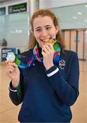 7 August 2023; The 2023 Irish World Para Swimming Championships swimmer Róisín Ní Riain poses for a photograph with her Gold and Silver medals at Dublin Airport on Team Ireland's return from the 2023 World Para Swimming Championships in Manchester. Photo by Tyler Miller/Sportsfile