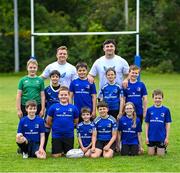 9 August 2023; Leinster players, Liam Turner, left, and Thomas Clarkson with participants during the Bank of Ireland Leinster Rugby Summer Camp at MU Barnhall RFC in Leixlip, Kildare. Photo by Piaras Ó Mídheach/Sportsfile