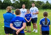 9 August 2023; Leinster players, Liam Turner, left, and Thomas Clarkson with Liaden Tew pose for photograph during the Bank of Ireland Leinster Rugby Summer Camp at MU Barnhall RFC in Leixlip, Kildare. Photo by Piaras Ó Mídheach/Sportsfile