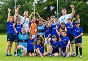 9 August 2023; Leinster players, Liam Turner, left, and Thomas Clarkson with participants during the Bank of Ireland Leinster Rugby Summer Camp at MU Barnhall RFC in Leixlip, Kildare. Photo by Piaras Ó Mídheach/Sportsfile