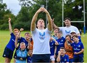 9 August 2023; Leinster player Liam Turner taking selfie with participants during the Bank of Ireland Leinster Rugby Summer Camp at MU Barnhall RFC in Leixlip, Kildare. Photo by Piaras Ó Mídheach/Sportsfile