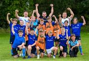 9 August 2023; Leinster players Liam Turner, left, and Thomas Clarkson and coach Eoin Farrell, centre, with participants during the Bank of Ireland Leinster Rugby Summer Camp at MU Barnhall RFC in Leixlip, Kildare. Photo by Piaras Ó Mídheach/Sportsfile