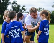 9 August 2023; Leinster player Liam Turner signs autographs for participants during the Bank of Ireland Leinster Rugby Summer Camp at MU Barnhall RFC in Leixlip, Kildare. Photo by Piaras Ó Mídheach/Sportsfile