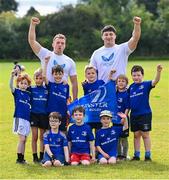 9 August 2023; Leinster players, Liam Turner, left, and Thomas Clarkson with participants during the Bank of Ireland Leinster Rugby Summer Camp at MU Barnhall RFC in Leixlip, Kildare. Photo by Piaras Ó Mídheach/Sportsfile