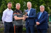 10 August 2023; PwC GAA/GPA Player of the Month for July in hurling, Cian Lynch of Limerick, is presented with his award by John Daly, Partner, PwC, in the company of GPA Player Welfare and Engagement Manager Colm Begley, left, and Munster GAA chairman Ger Ryan, right, at PwC offices in Limerick. Photo by Stephen McCarthy/Sportsfile
