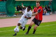 10 August 2023; Serges Déblé of Tobol in action against Cameron McJannet of Derry City, right, during the UEFA Europa Conference League Third Qualifying Round First Leg match between Tobol and Derry City at Kostanay Central Stadium in Kostanay, Kazakhstan. Photo by Kaskyrbai Koishymanov/Sportsfile