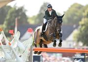 11 August 2023; Michael Pender of Ireland competes on Hhs Calais during the Longines FEI Jumping Nations Cup™ of Ireland international competition during the 2023 Longines FEI Dublin Horse Show at the RDS in Dublin. Photo by David Fitzgerald/Sportsfile