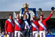 11 August 2023; Switzerland Chef d'Equipe Michel Sorg lifts the Aga Khan trophy with the team during the Longines FEI Jumping Nations Cup™ of Ireland international competition during the 2023 Longines FEI Dublin Horse Show at the RDS in Dublin. Photo by David Fitzgerald/Sportsfile