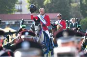 11 August 2023; Martin Fuchs of Switzerland rides behind the band after winning the Aga Khan trophy during the Longines FEI Jumping Nations Cup™ of Ireland international competition during the 2023 Longines FEI Dublin Horse Show at the RDS in Dublin. Photo by David Fitzgerald/Sportsfile