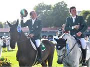 11 August 2023; Cian O'Connor of Ireland on Eve D'Ouilly, left, and Michael Duffy on Cinca 3 after finishing second in the Aga Khan during the Longines FEI Jumping Nations Cup™ of Ireland international competition during the 2023 Longines FEI Dublin Horse Show at the RDS in Dublin. Photo by David Fitzgerald/Sportsfile