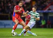 11 August 2023; Paddy Barrett of Shelbourne in action against Liam Burt of Shamrock Rovers during the SSE Airtricity Men's Premier Division match between Shelbourne and Shamrock Rovers at Tolka Park in Dublin. Photo by Seb Daly/Sportsfile