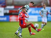 11 August 2023; Shane Griffin of Shelbourne in action against Ronan Finn of Shamrock Rovers during the SSE Airtricity Men's Premier Division match between Shelbourne and Shamrock Rovers at Tolka Park in Dublin. Photo by Seb Daly/Sportsfile