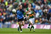 30 July 2023; Lily Monahan, Scoil Naomh Iósaf, Baltinglass, Wicklow, representing Dublin, in action against Bláithín Mallon, Moneynick PS, Randalstown, Antrim, representing Kerry, during the INTO Cumann na mBunscol GAA Respect Exhibition Go Games at the GAA Football All-Ireland Senior Championship final match between Dublin and Kerry at Croke Park in Dublin. Photo by Eóin Noonan/Sportsfile