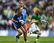 30 July 2023; Lily Monahan, Scoil Naomh Iósaf, Baltinglass, Wicklow, representing Dublin, in action against Bláithín Mallon, Moneynick PS, Randalstown, Antrim, representing Kerry, during the INTO Cumann na mBunscol GAA Respect Exhibition Go Games at the GAA Football All-Ireland Senior Championship final match between Dublin and Kerry at Croke Park in Dublin. Photo by Eóin Noonan/Sportsfile